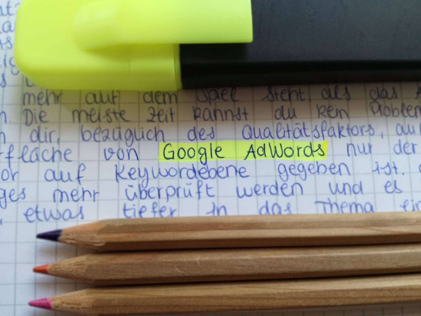 Google Local Ads: How Small Businesses Get Found by Customers Ready to Buy Close-up of colorful pencils on handwritten notes with Google AdWords highlighted.